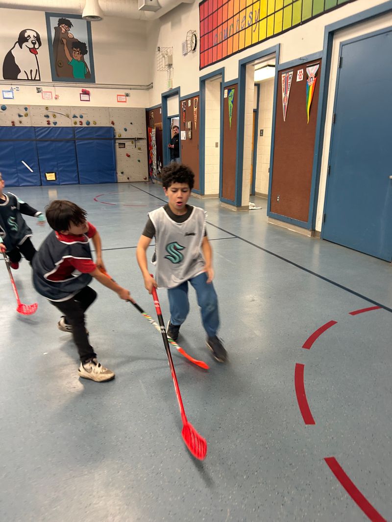 Ball hockey action at Beverly Elementary