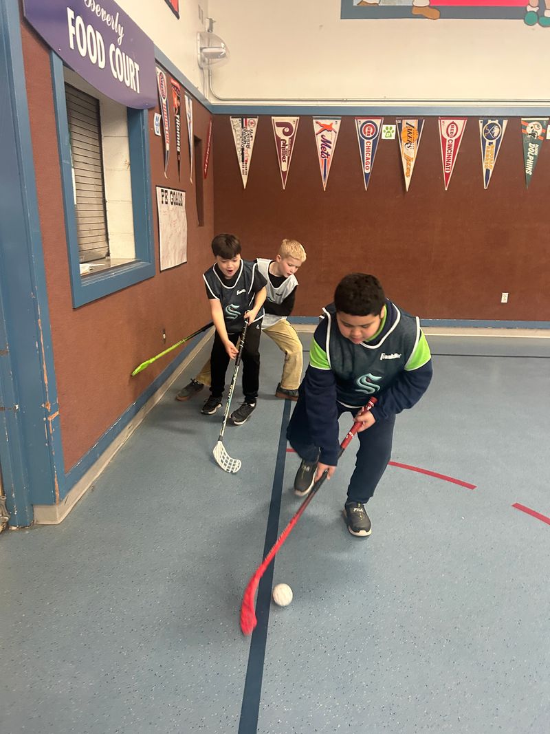 Ball hockey action at Beverly Elementary
