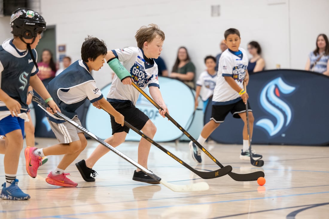 Young players battle for the ball during Grow the Game Day