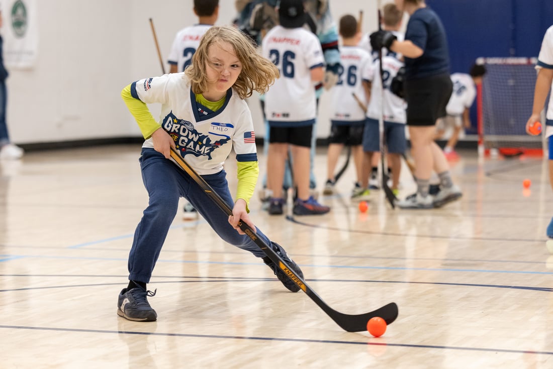 A young player drives the ball up the floor