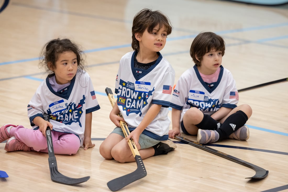 Players gather and listen during a coaching session